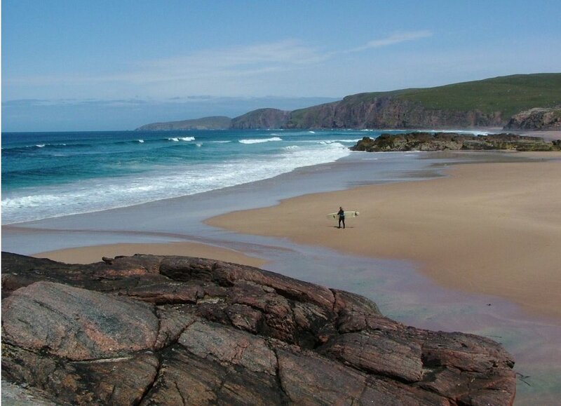 Surfer on a sandy beach