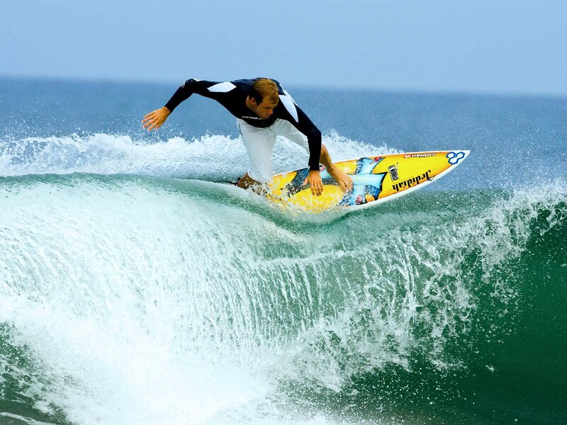 Surfer on a Wave — Blue, Dynamic, Afternoon, Photograph, Surfboard, Ocean, Green, Yellow
