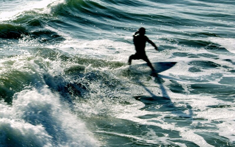 Surfer on a Wave — Ocean
