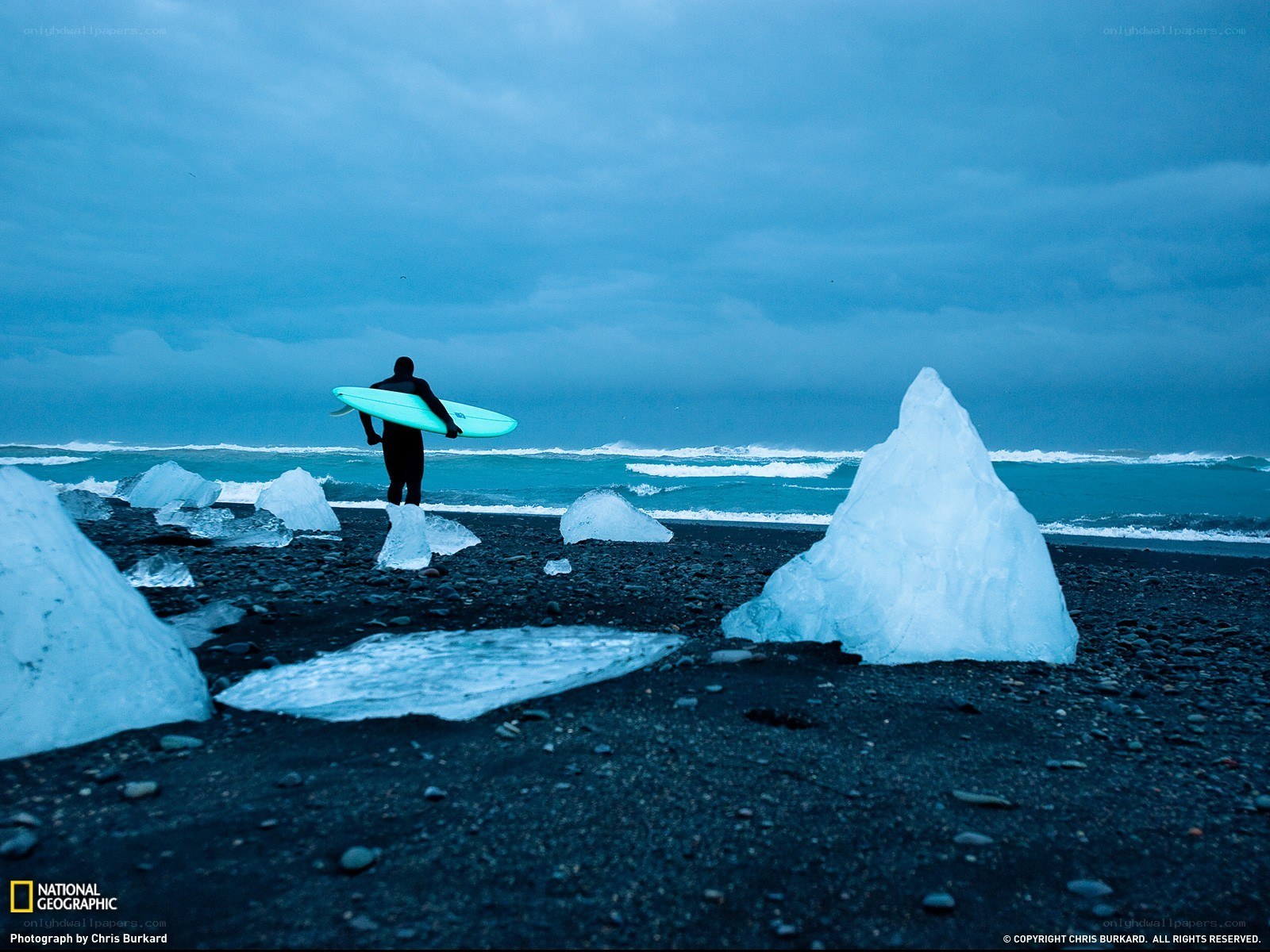 Surfer on an icy beach