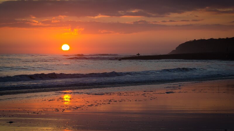 Surfer on Beach at Sunset — Orange, Serene