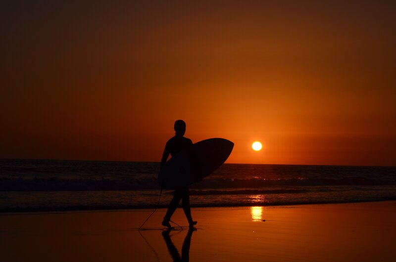 Surfer on Beach — Orange, Serene, Sunset, Photograph, Sun, Ocean
