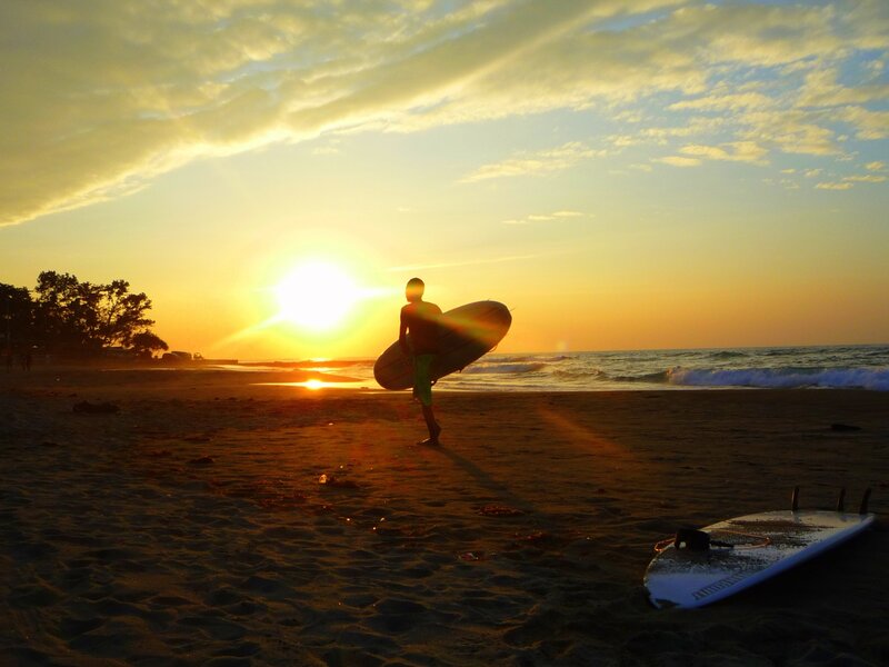 Surfer on Beach — Orange, Serene, Sunset, Photograph