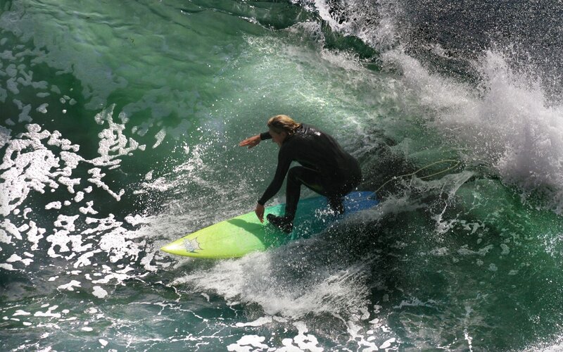 Surfer on Green Surfboard