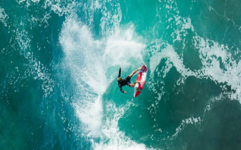 Surfer on Red Board