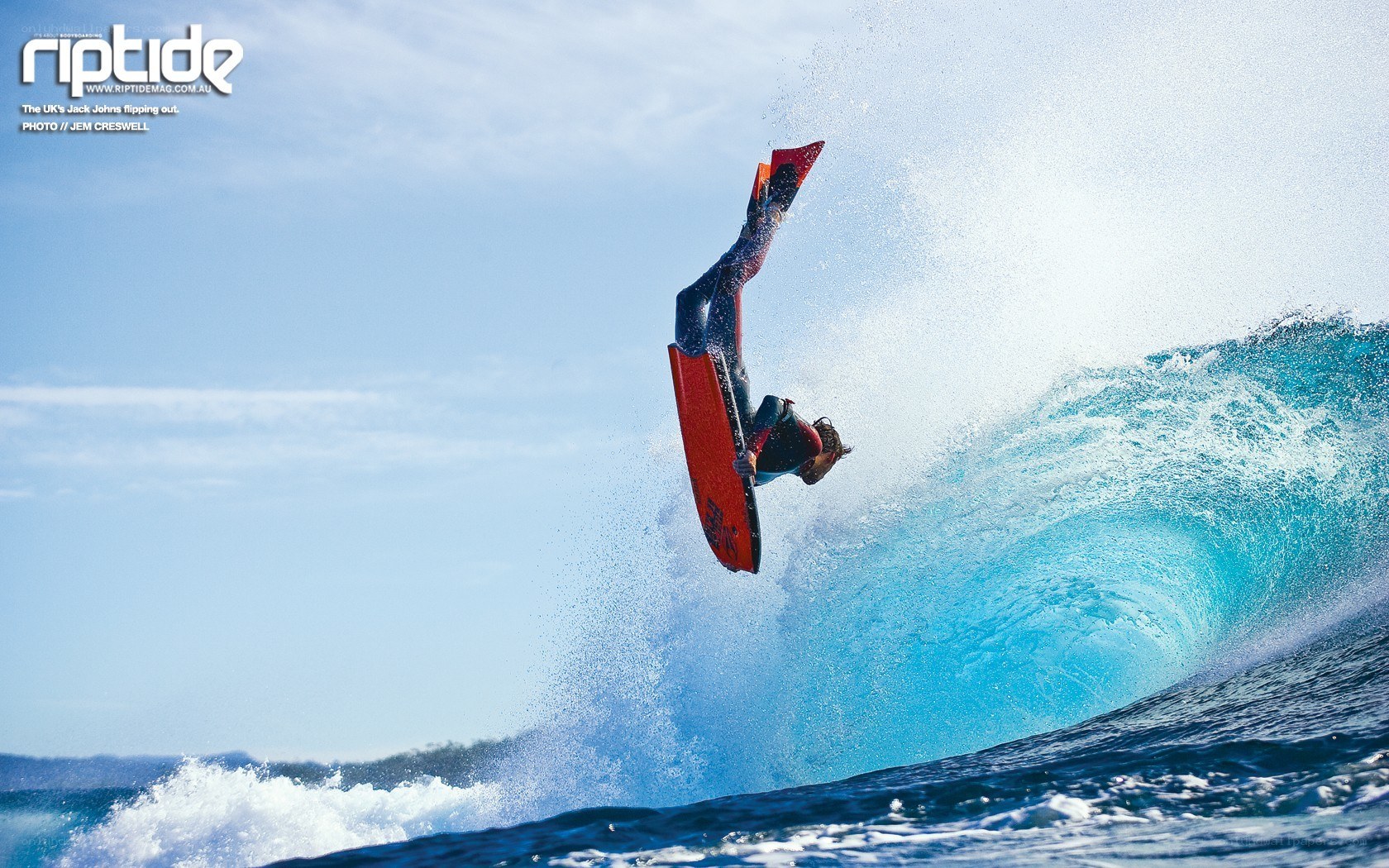 Surfer performing aerial maneuver