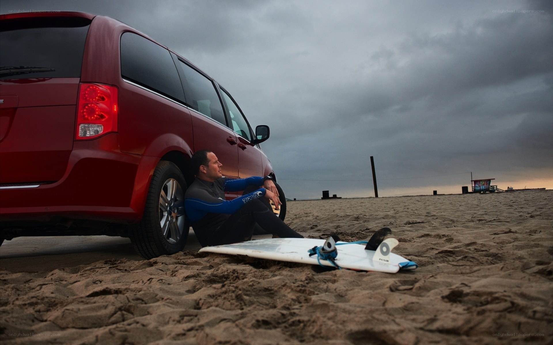 Surfer resting on beach