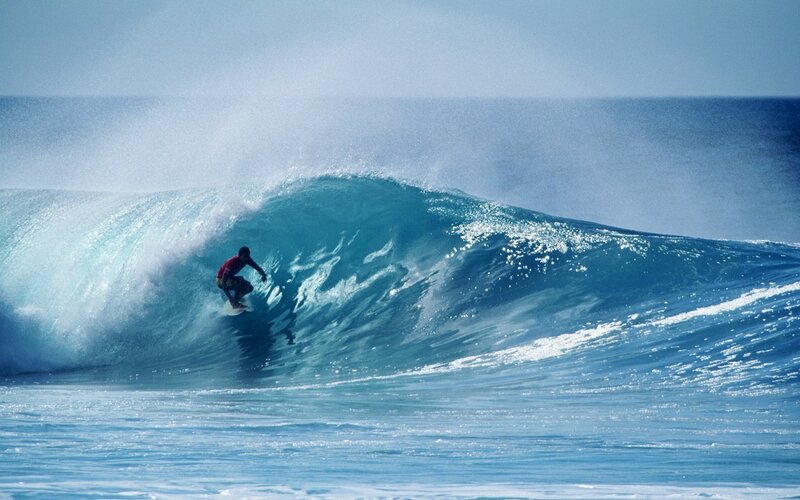 Surfer riding a large wave