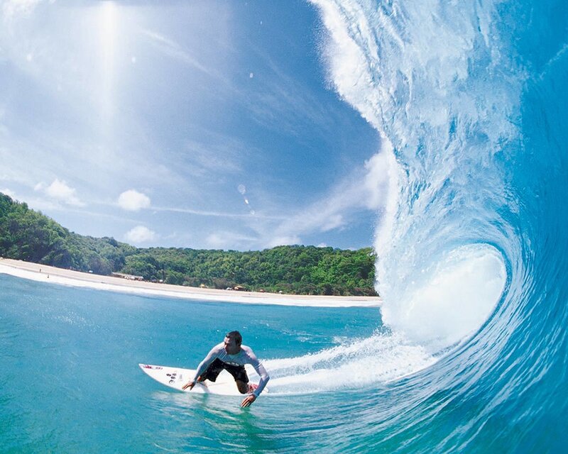 Surfer riding a large wave