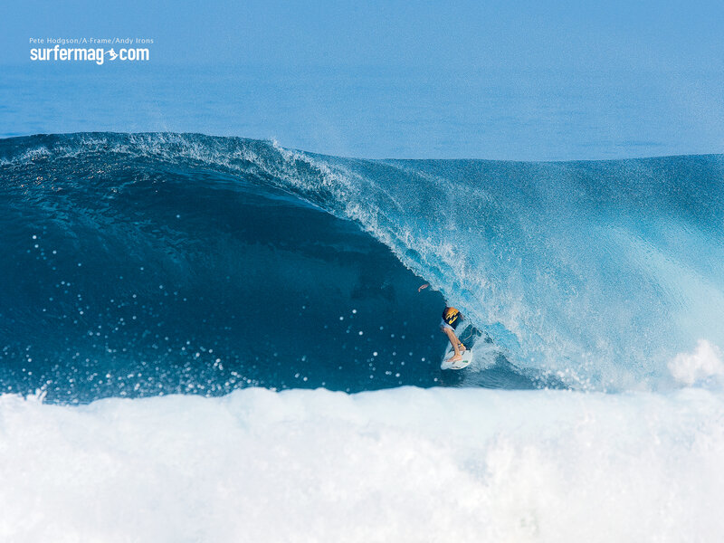 Surfer riding a large wave