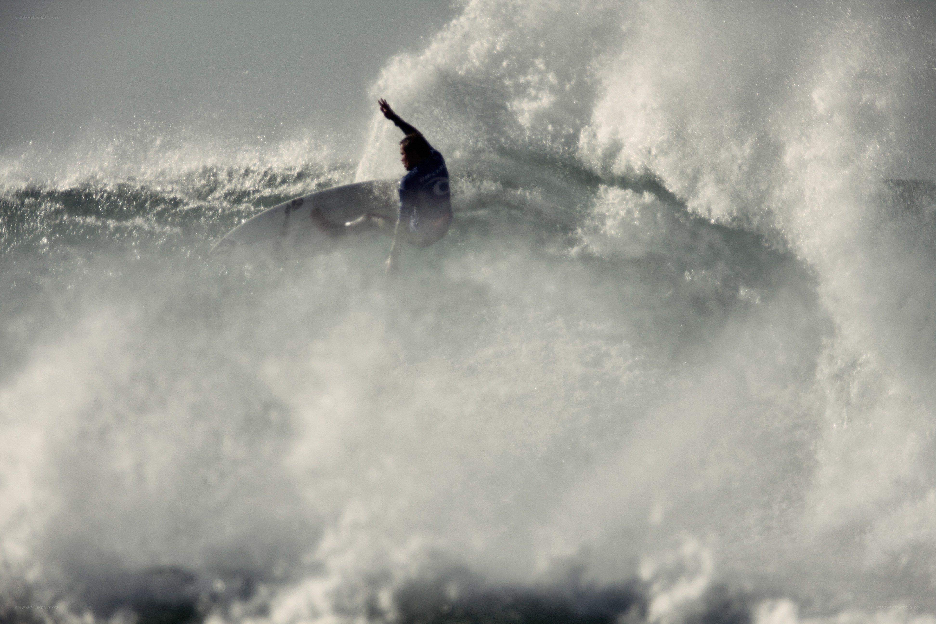 Surfer riding a large wave