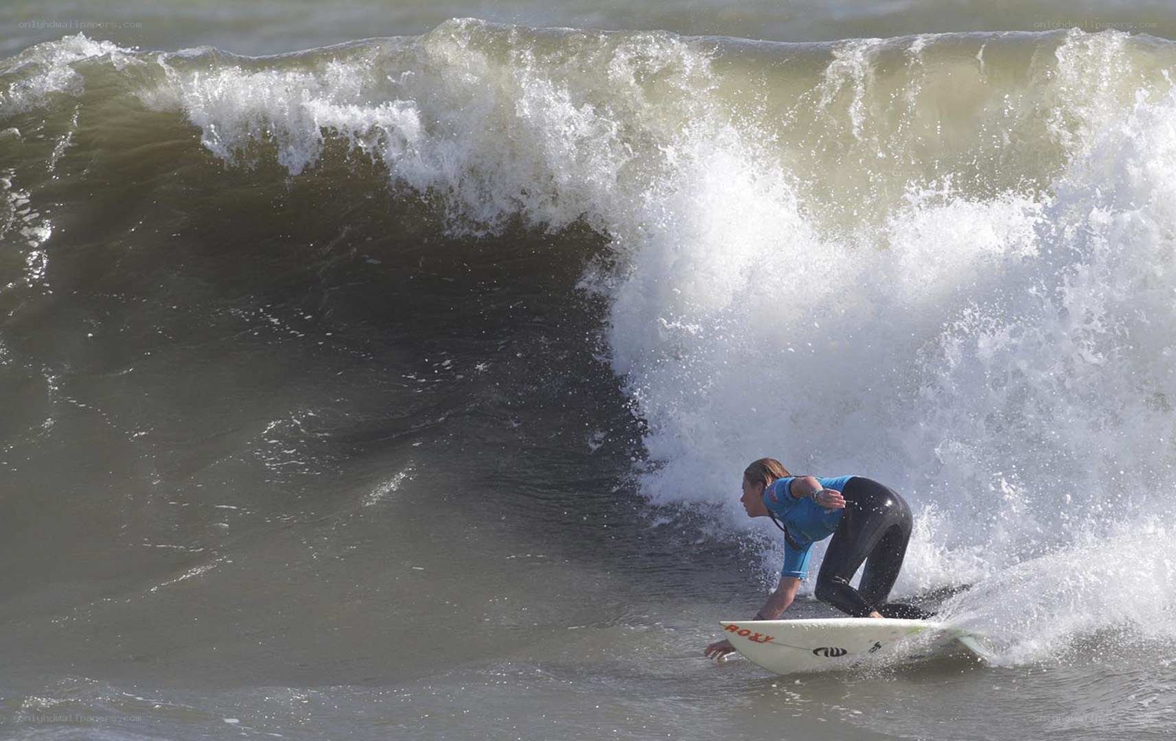Surfer riding a large wave