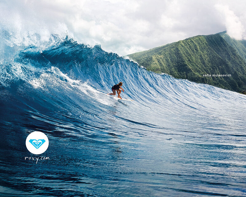 Surfer riding a large wave
