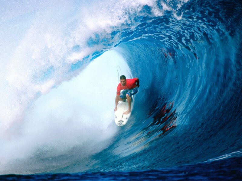 Surfer riding a wave tunnel