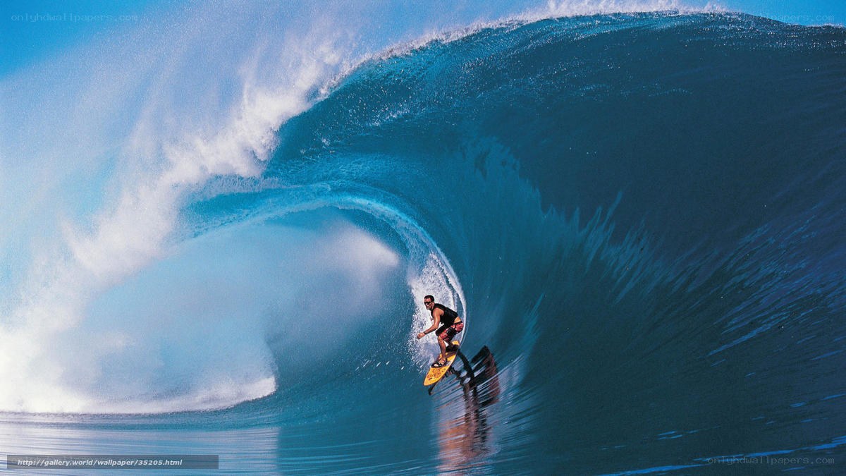 Surfer riding large wave