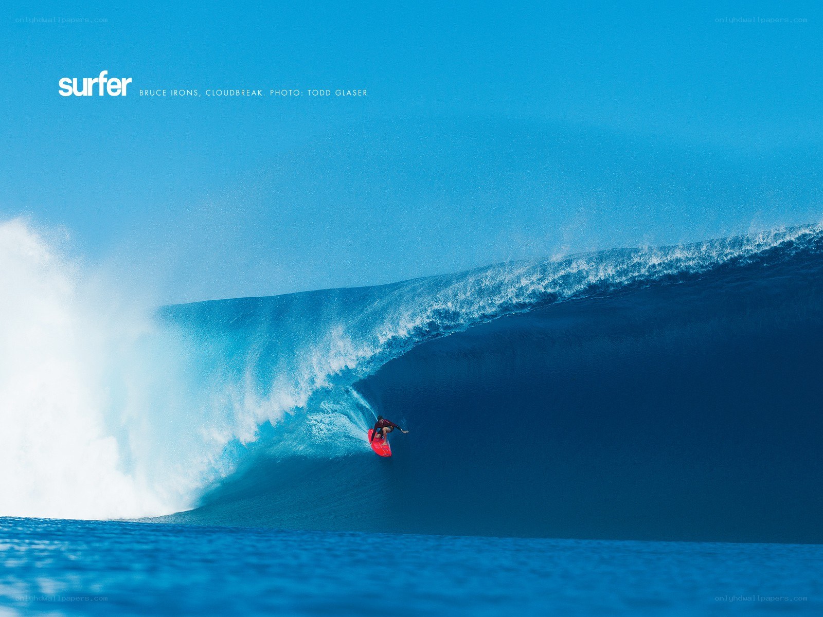 Surfer riding large wave