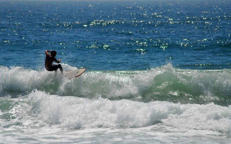 Surfer riding ocean wave