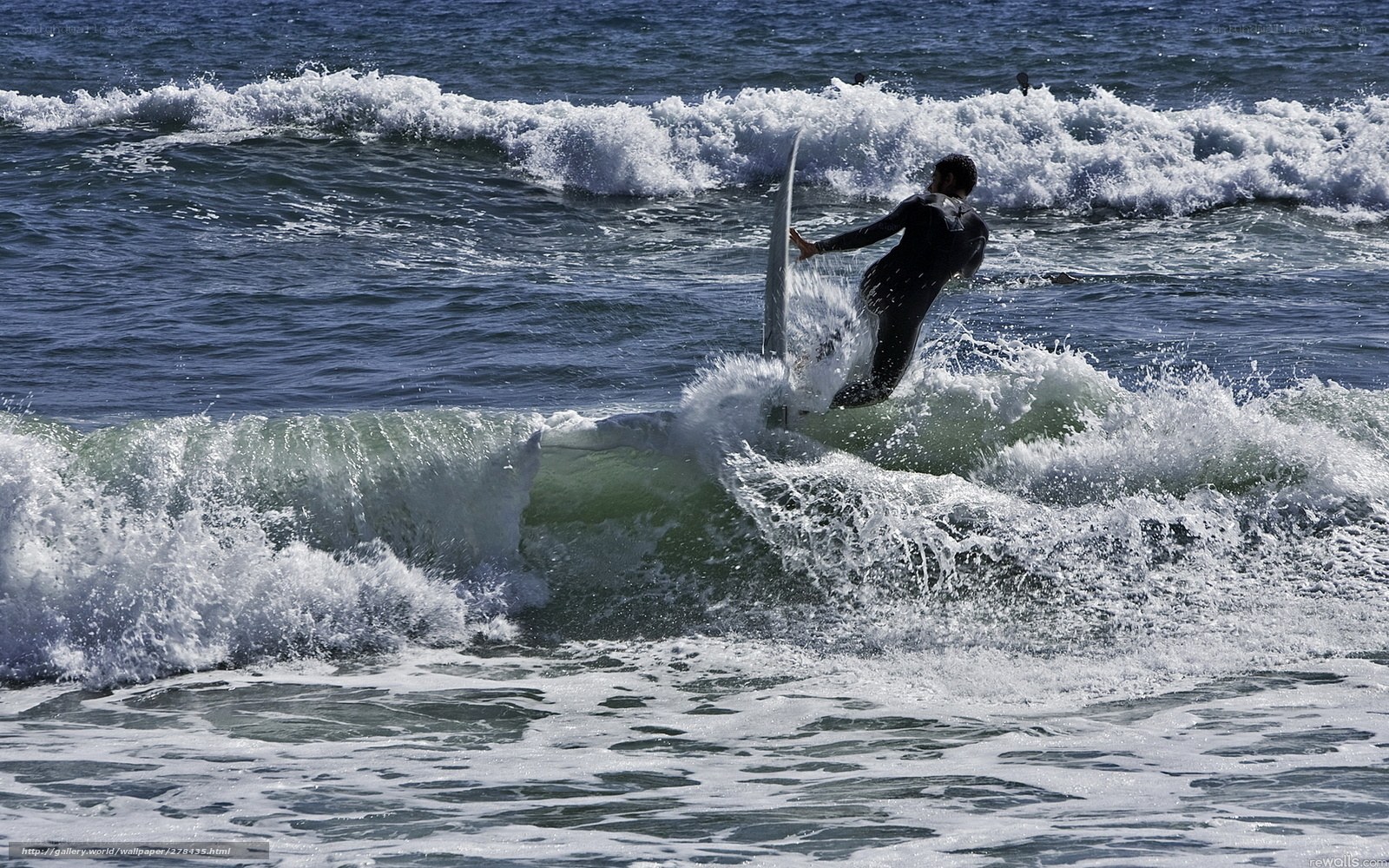Surfer riding ocean wave