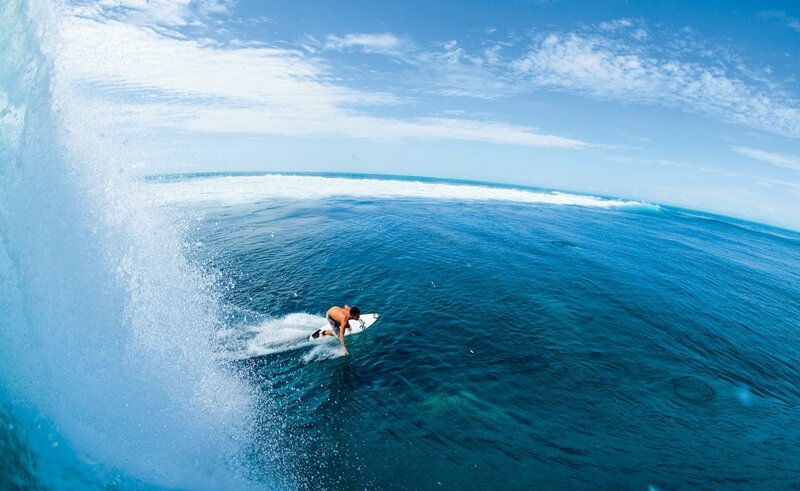 Surfer riding ocean wave