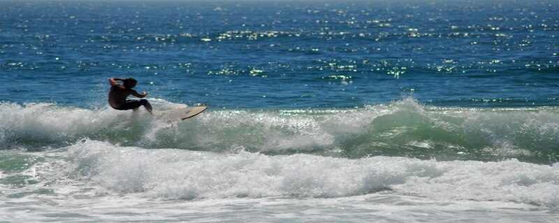 Surfer riding ocean wave