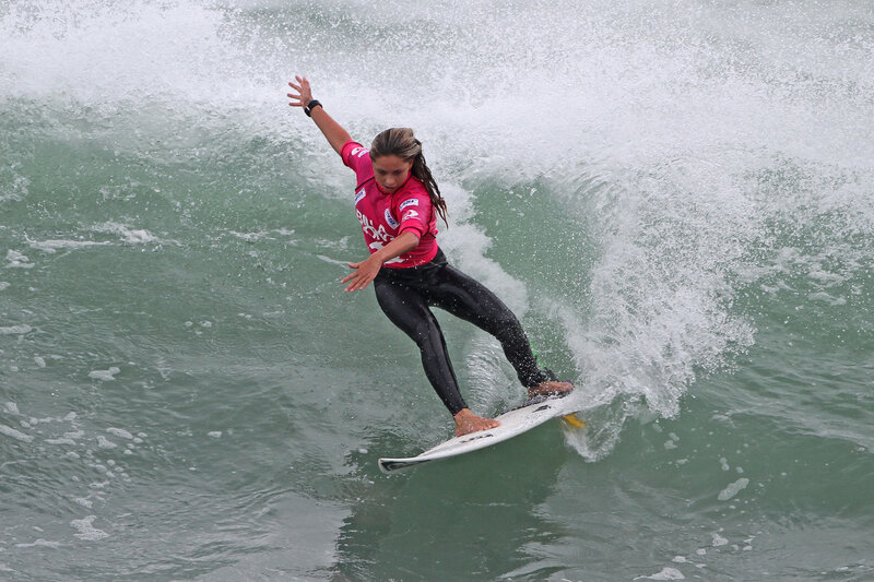 Surfer riding wave