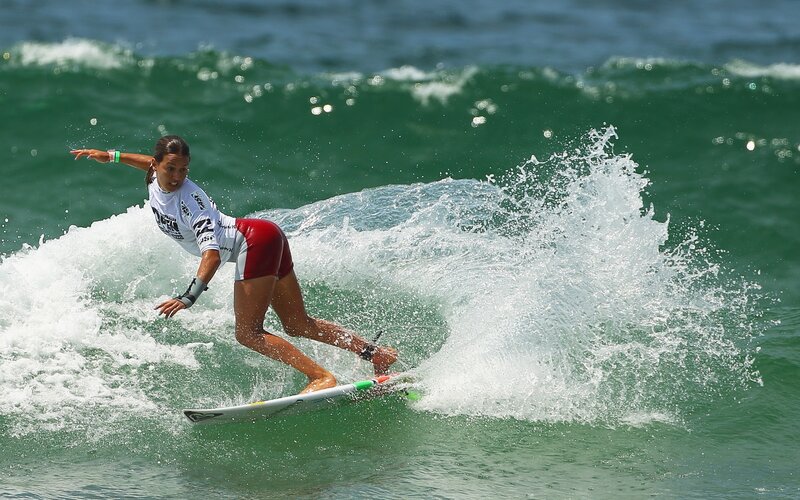 Surfer riding wave