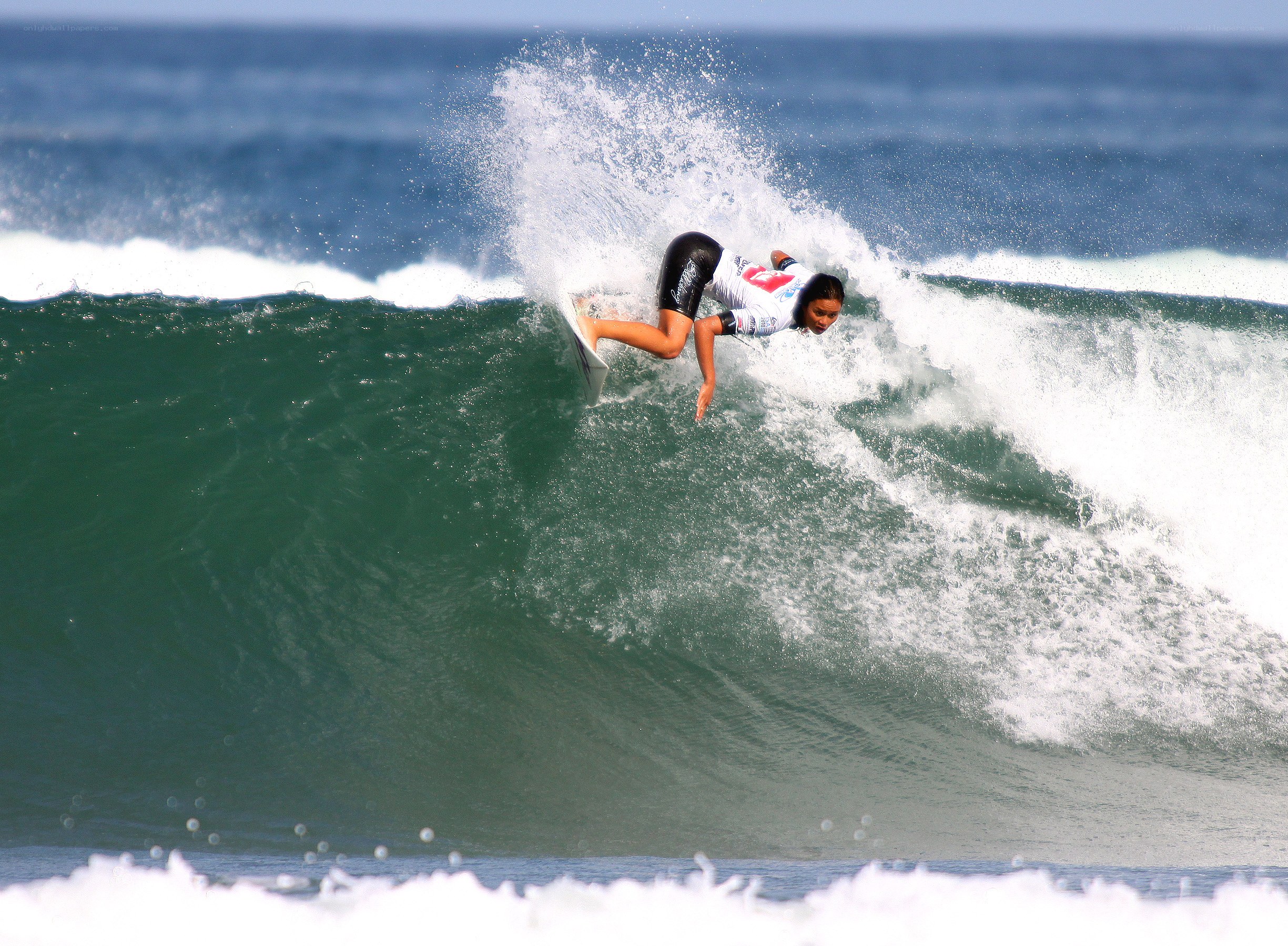 Surfer riding wave