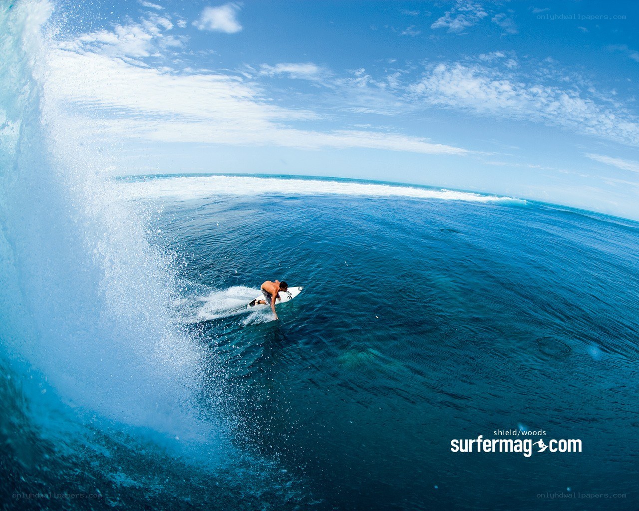 surfer riding wave at ocean