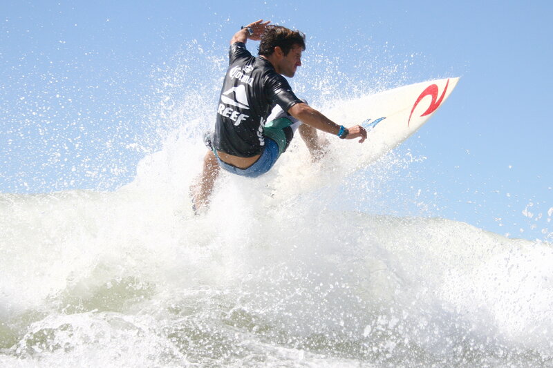 Surfer riding wave in action