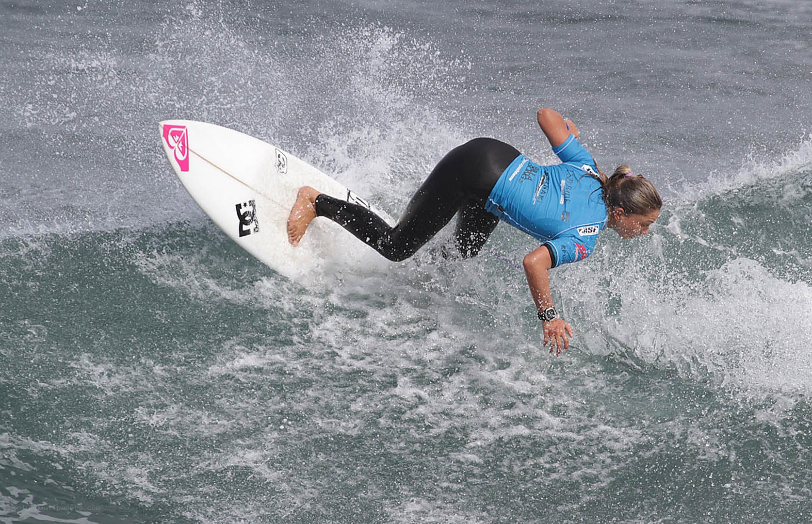 Surfer riding wave in action