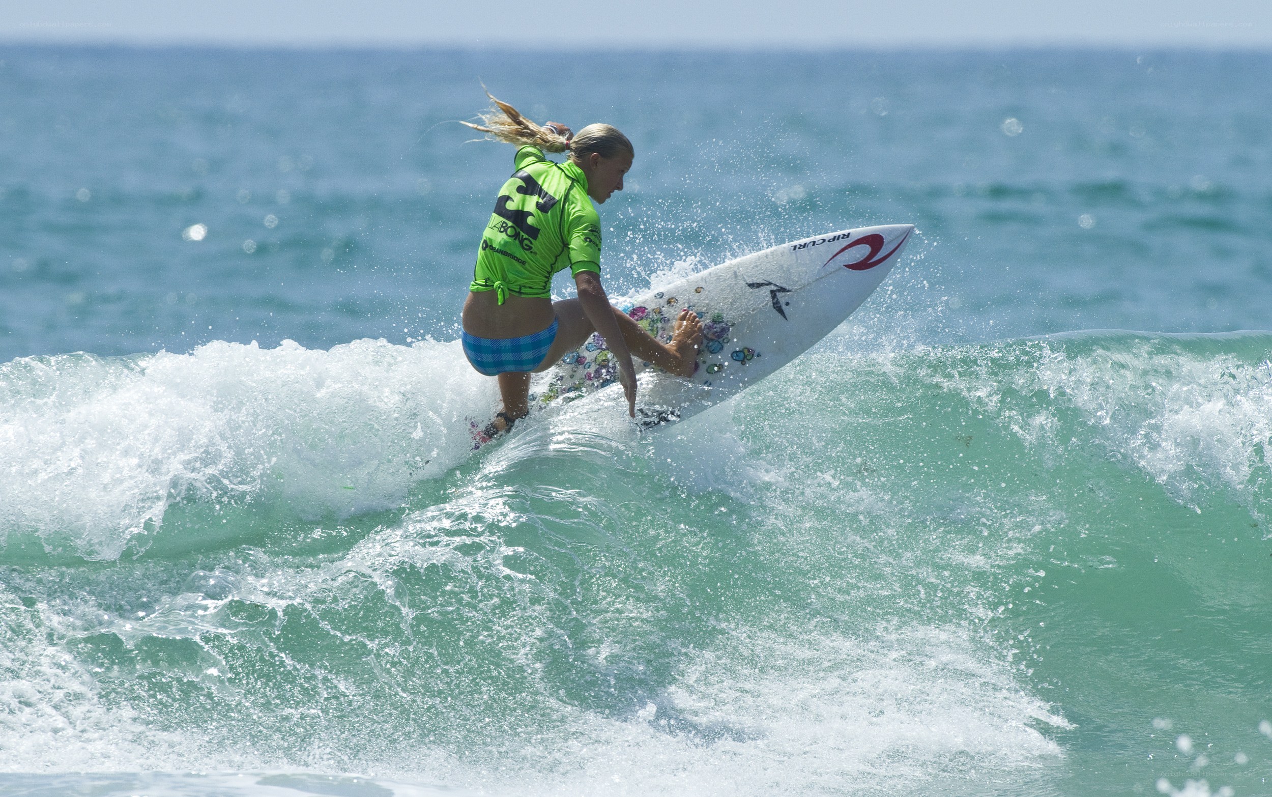 Surfer riding wave in ocean