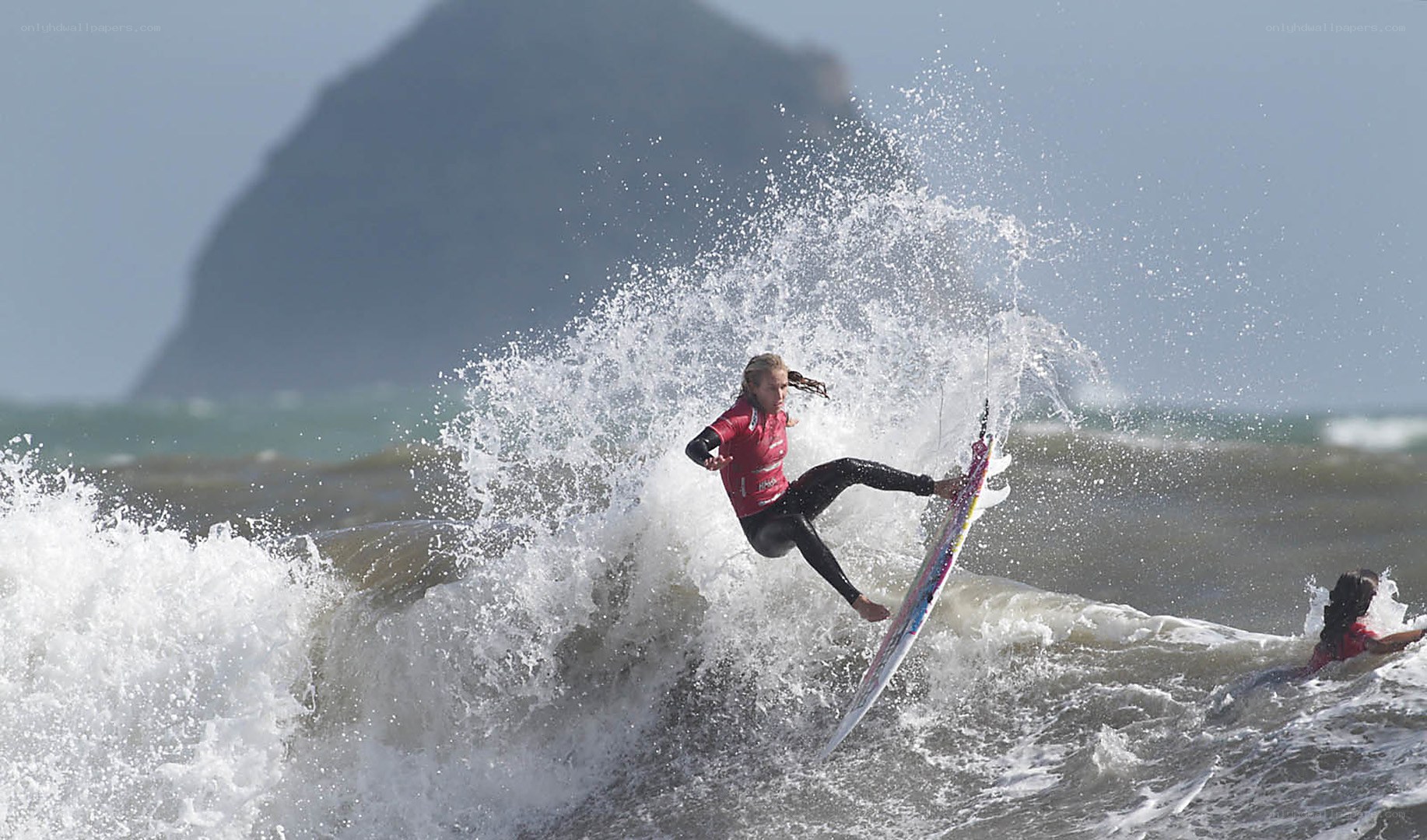 Surfer riding wave in ocean