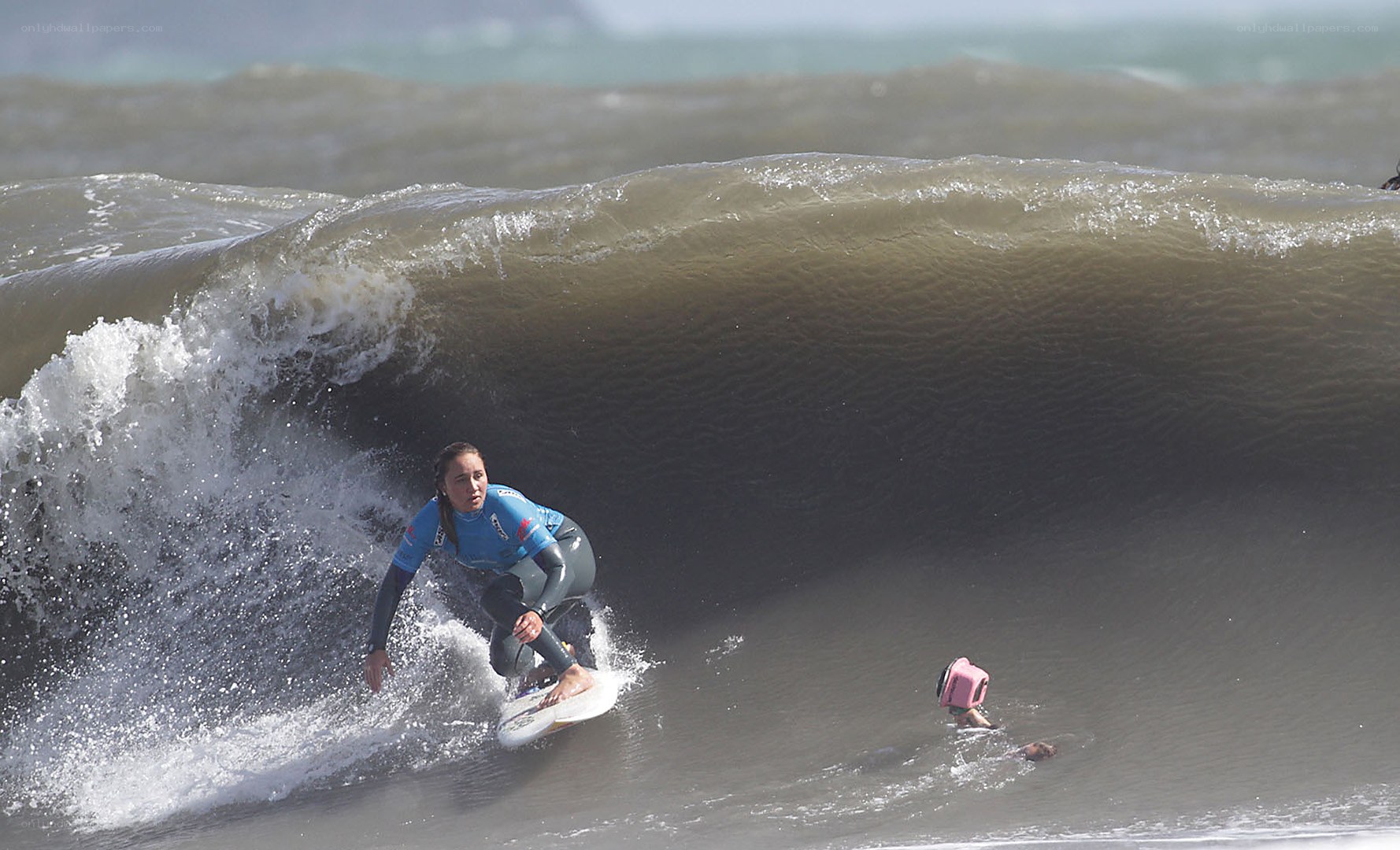 Surfer riding wave in ocean