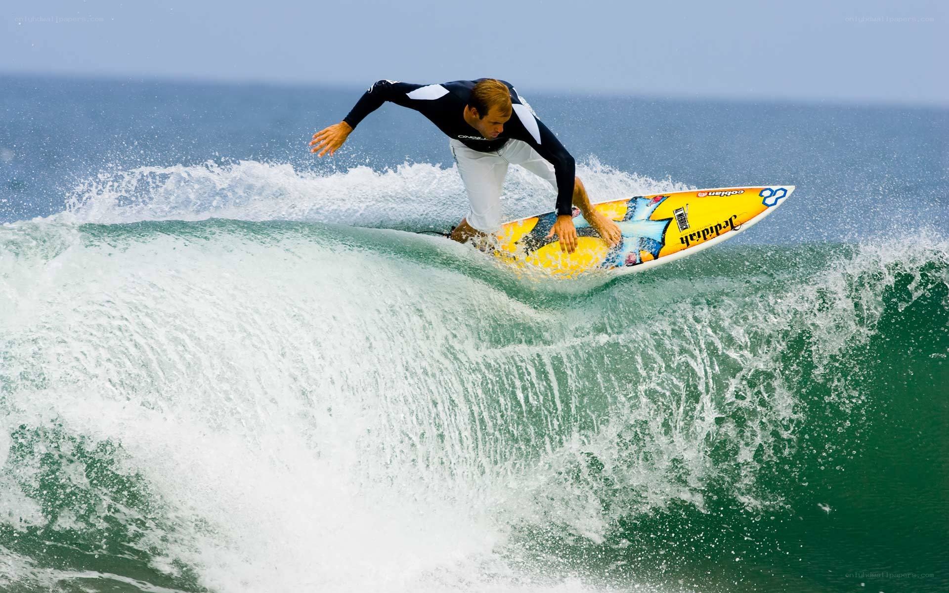 surfer riding wave on surfboard