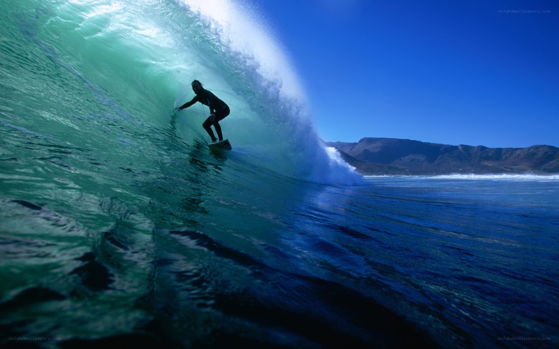Surfer riding wave tunnel