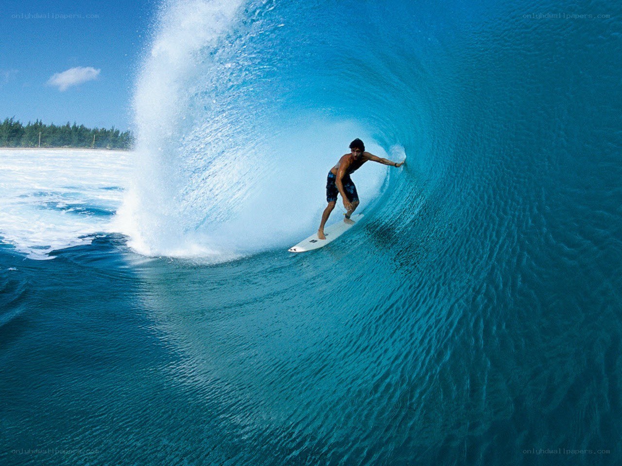 Surfer riding wave tunnel