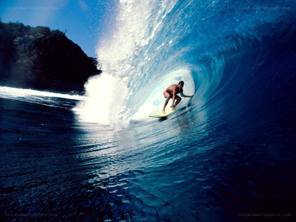 Surfer riding wave tunnel