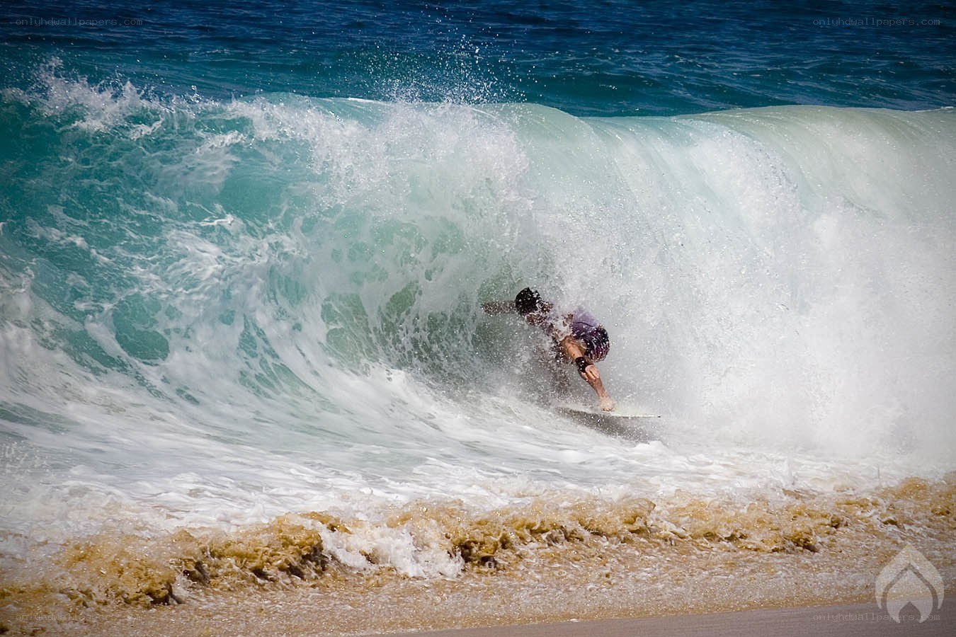 Surfer riding wave tunnel