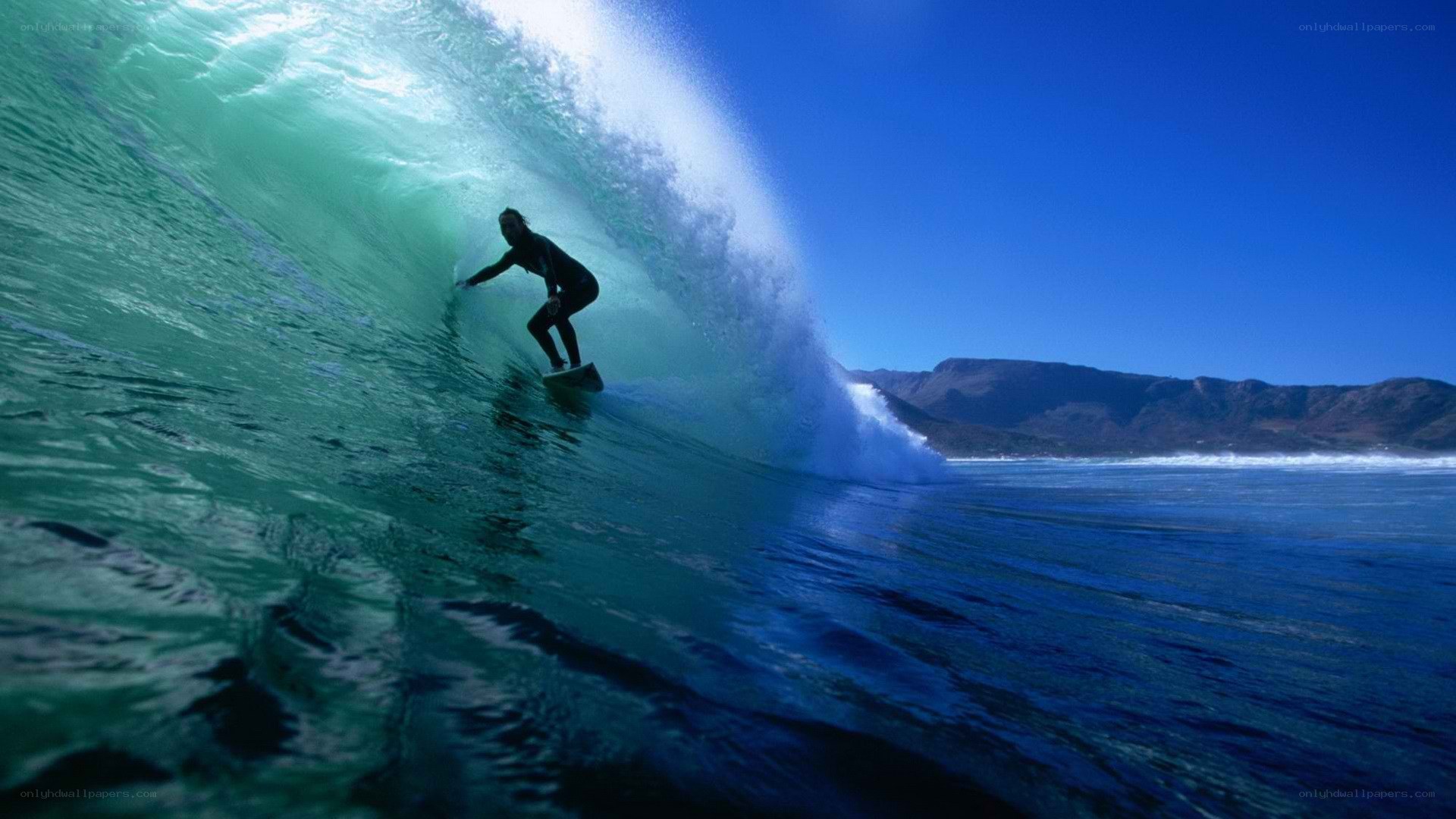 Surfer riding wave tunnel