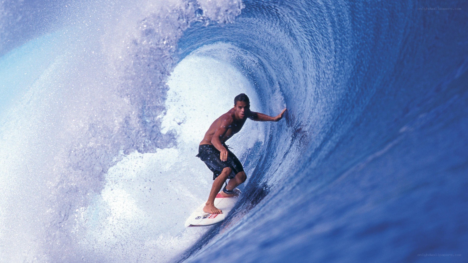surfer riding wave tunnel