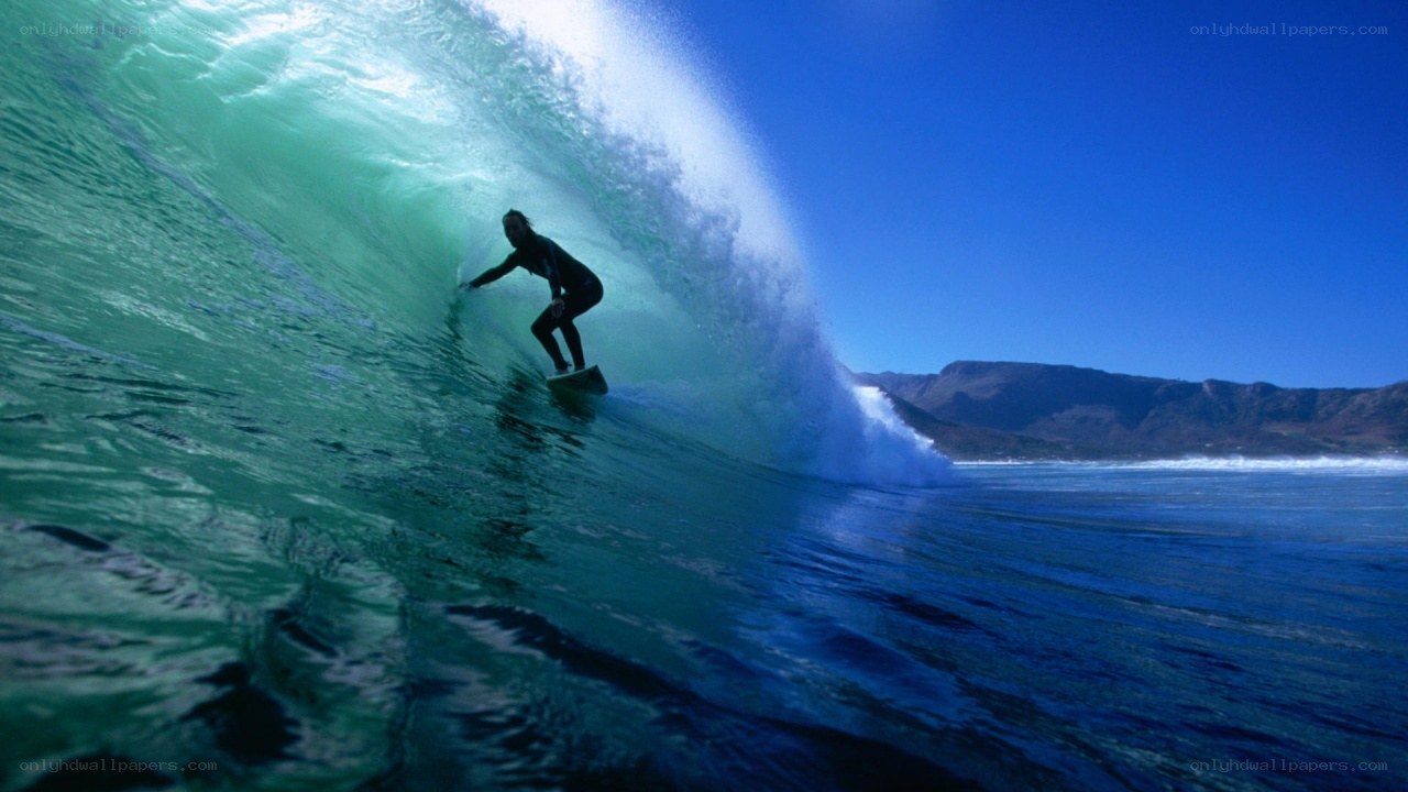 Surfer riding wave tunnel