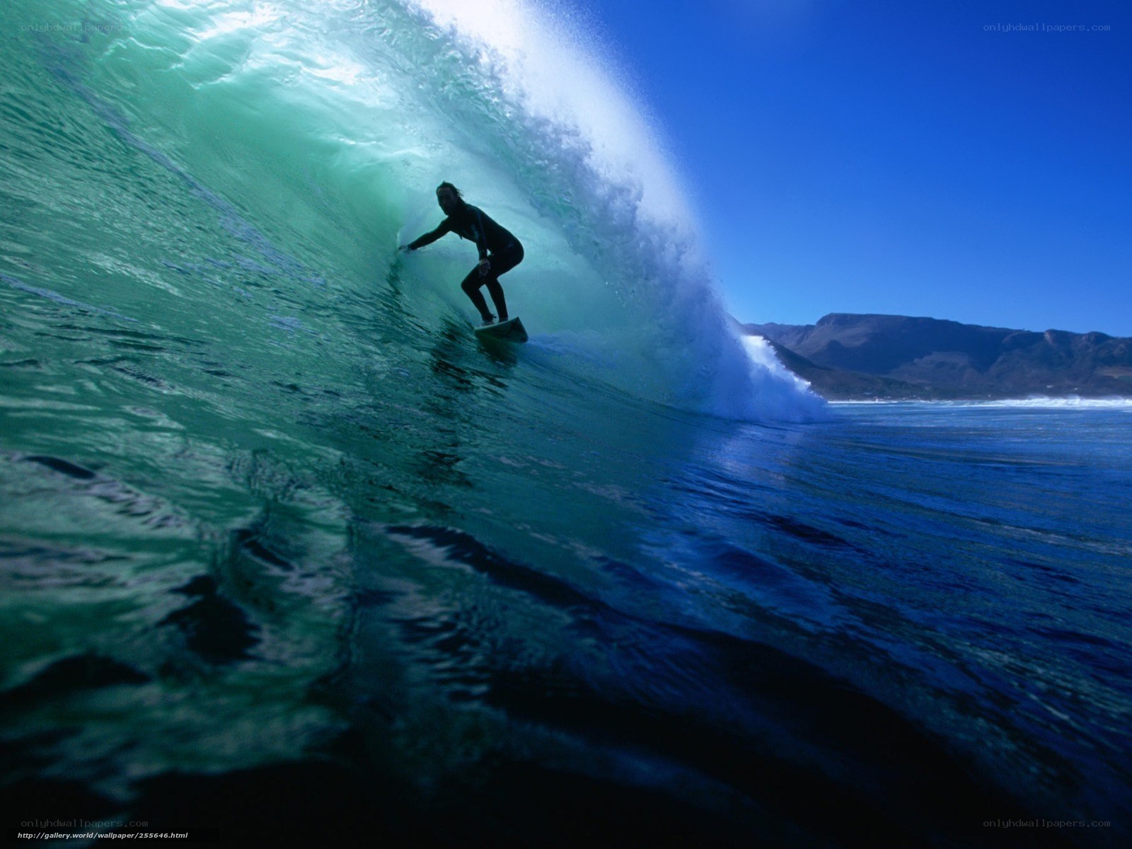 Surfer riding wave tunnel