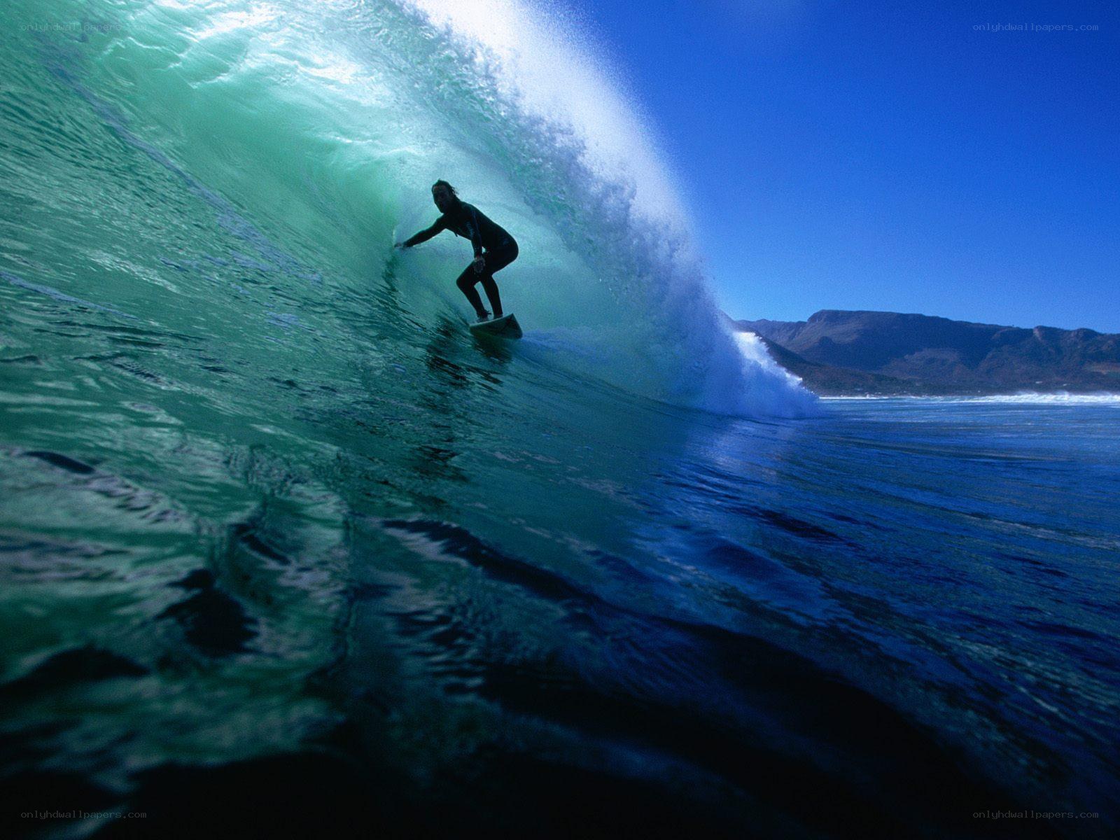 Surfer riding wave tunnel