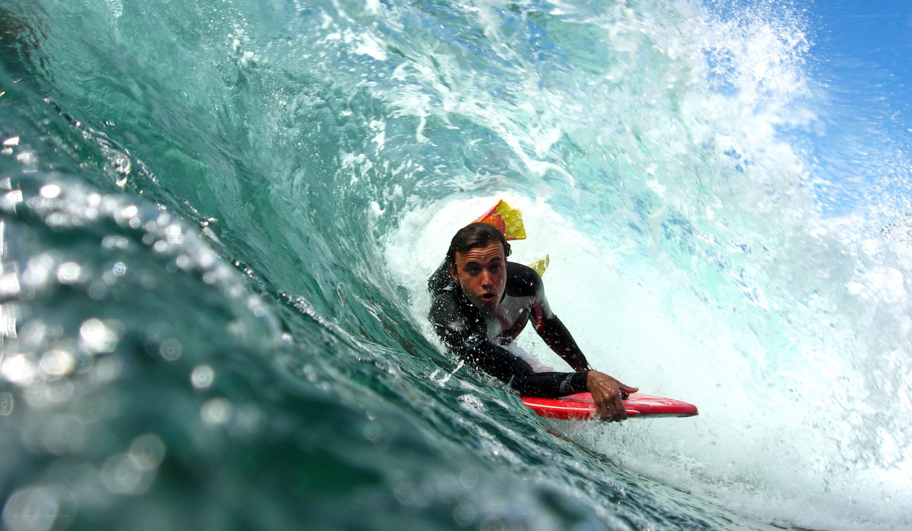 Surfer riding wave tunnel