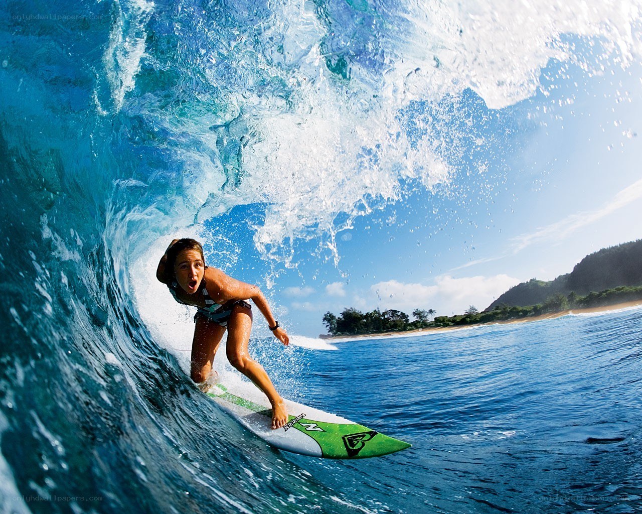 Surfer riding wave tunnel