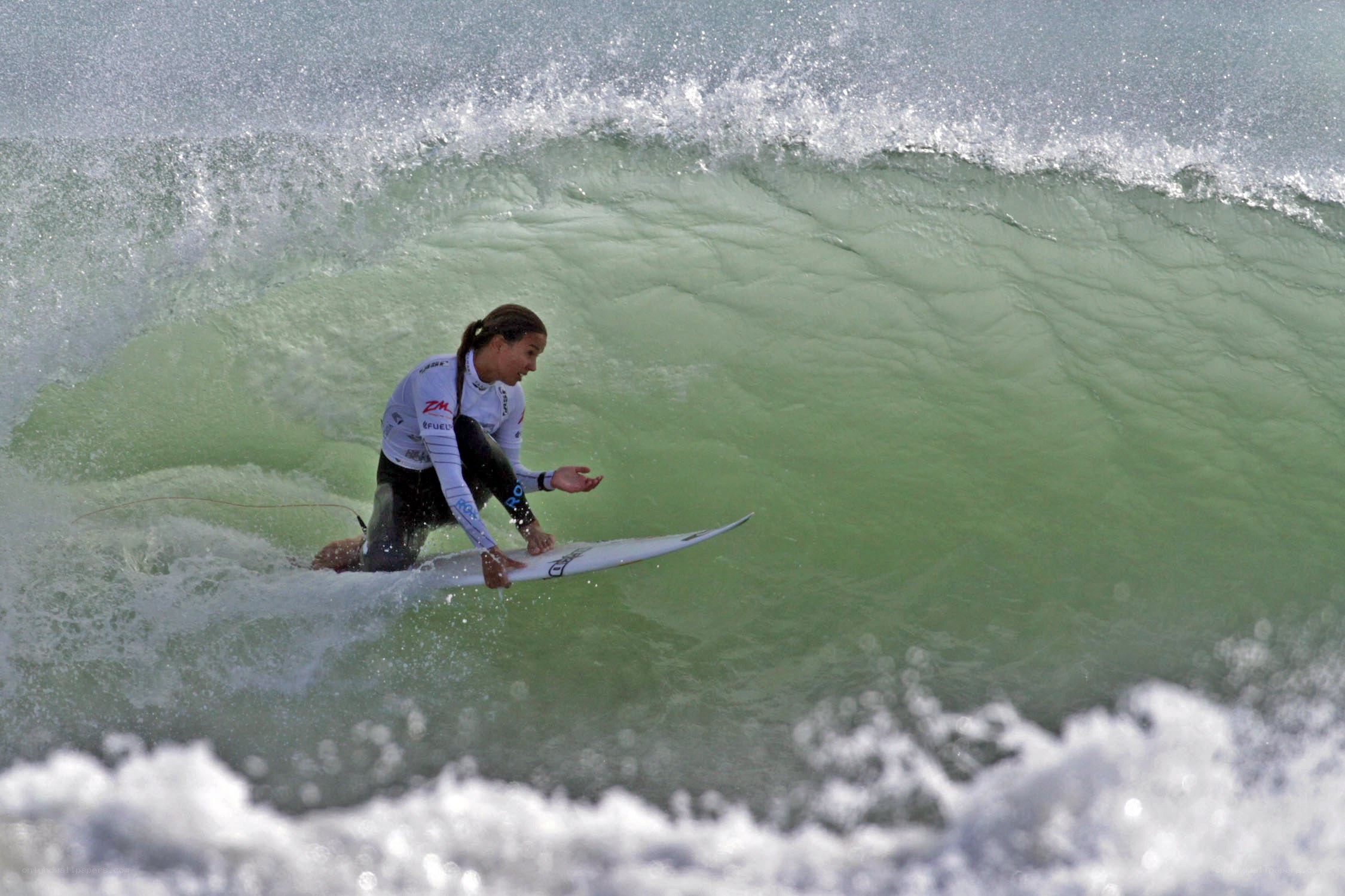 Surfer riding wave tunnel