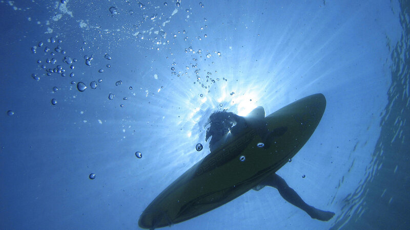 Surfer Underwater