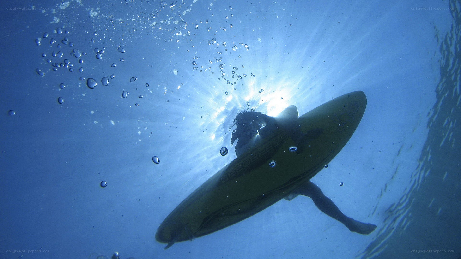 surfer underwater with board