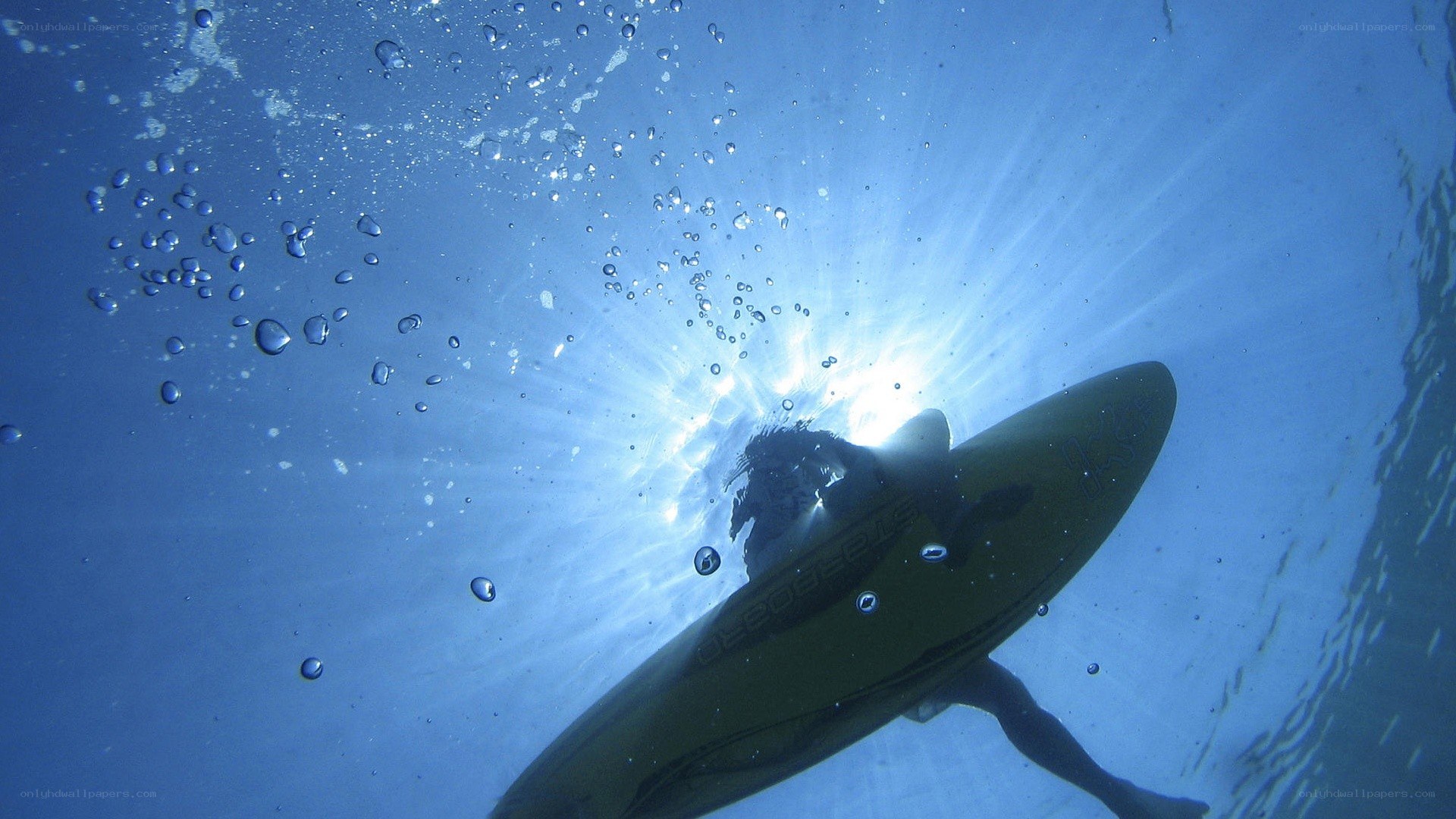 surfer underwater with board