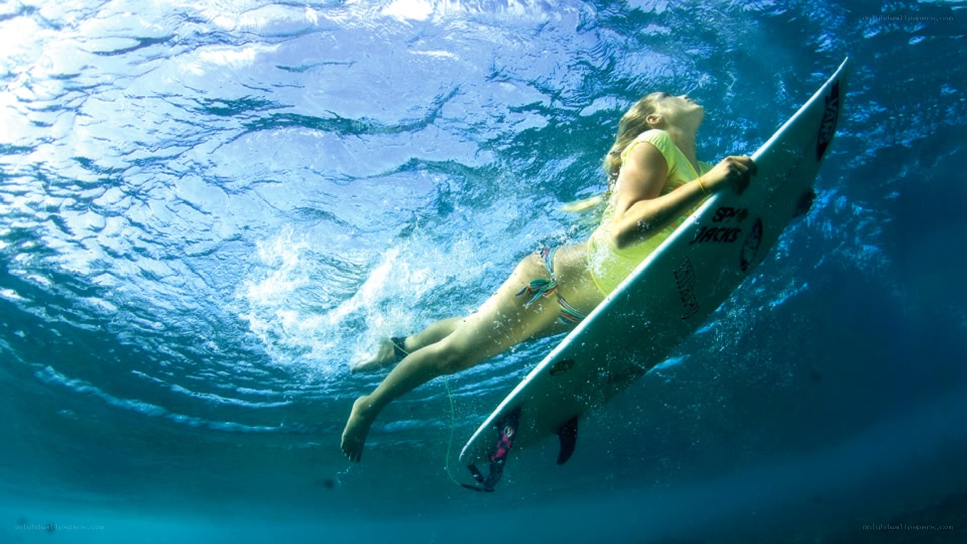 Surfer underwater with surfboard